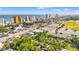 An aerial view showcases the city skyline, ocean, and an overview of the neighborhood and amenities at 506 28Th Ave. N, Myrtle Beach, SC 29577