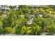 An aerial view shows a tree-lined property, showcasing its seclusion and natural surroundings at 506 28Th Ave. N, Myrtle Beach, SC 29577