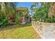 The side of the house includes a patio featuring concrete privacy walls and established landscaping at 506 28Th Ave. N, Myrtle Beach, SC 29577