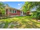 This home boasts a large backyard with screened porch and mature trees, perfect for outdoor living and relaxation at 506 28Th Ave. N, Myrtle Beach, SC 29577