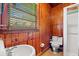 This quaint bathroom features wood paneling, classic fixtures, and a functional shower space at 506 28Th Ave. N, Myrtle Beach, SC 29577