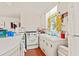 Bright kitchen with vintage appliances, white cabinets, and abundant natural light, blending charm and functionality at 506 28Th Ave. N, Myrtle Beach, SC 29577