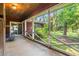 A covered porch offers an outdoor space with views of the surrounding yard at 506 28Th Ave. N, Myrtle Beach, SC 29577