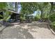 Inviting backyard oasis with a cozy gazebo, lounge chairs, and dining area surrounded by lush greenery at 520 13Th Ave. N, Surfside Beach, SC 29575