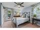 Inviting bedroom featuring a bed, dresser, and a view to the backyard patio at 520 13Th Ave. N, Surfside Beach, SC 29575