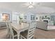 Open dining room with seating for six with views of living room and front door at 520 13Th Ave. N, Surfside Beach, SC 29575