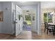 Bright entryway showcasing wood floors, decorative wallpaper, and views to the front porch at 520 13Th Ave. N, Surfside Beach, SC 29575