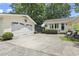 Charming house with white garage and concrete driveway at 520 13Th Ave. N, Surfside Beach, SC 29575