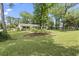 Lush front yard showcasing a well-manicured lawn and mature trees at 520 13Th Ave. N, Surfside Beach, SC 29575
