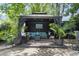 Backyard gazebo with comfortable seating, lush greenery, and a cozy atmosphere at 520 13Th Ave. N, Surfside Beach, SC 29575