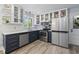 Well-appointed kitchen featuring modern appliances, sleek cabinets, and wood-style flooring at 520 13Th Ave. N, Surfside Beach, SC 29575