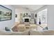 Cozy living room featuring a painted fireplace, comfortable seating, and stylish decor at 520 13Th Ave. N, Surfside Beach, SC 29575