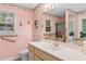 Well-lit bathroom features a large mirror, grab bars, and a shower with a curtain at 556 Crusade Circle, Conway, SC 29526
