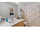 Standard bathroom featuring a single sink vanity and seashell themed shower curtain at 556 Crusade Circle, Conway, SC 29526