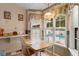 Bright breakfast nook features a pool view, decorative wallpaper, and natural light at 556 Crusade Circle, Conway, SC 29526
