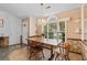 Charming dining area with beautiful lighting, decorative wall paper, and a large window at 556 Crusade Circle, Conway, SC 29526