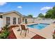 Backyard pool with a patio, seating area and lush landscaping, great for entertaining at 556 Crusade Circle, Conway, SC 29526