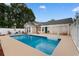 Backyard view of a refreshing swimming pool, patio space and a white pergola at 556 Crusade Circle, Conway, SC 29526