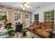 Relaxing sunroom with a cozy fireplace and comfortable seating at 556 Crusade Circle, Conway, SC 29526