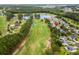 Aerial shot of a community near a golf course and pond. Lots of trees at 583 Wildflower Trail, Myrtle Beach, SC 29579