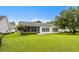 A sunroom features a screen, offering a charming extension to the backyard and living space at 583 Wildflower Trail, Myrtle Beach, SC 29579