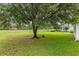 Lush backyard with mature tree providing shade, close to neighborhood at 583 Wildflower Trail, Myrtle Beach, SC 29579