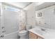 Bright bathroom featuring a shower/tub combo, white vanity, floral wallpaper border and natural light at 583 Wildflower Trail, Myrtle Beach, SC 29579