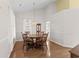 Dining room features a wood table with six chairs and a hanging chandelier at 583 Wildflower Trail, Myrtle Beach, SC 29579