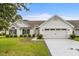 Charming single story home with a two car garage and a well manicured front lawn at 583 Wildflower Trail, Myrtle Beach, SC 29579