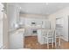 Spacious kitchen featuring white cabinetry, a central island, and modern appliances at 583 Wildflower Trail, Myrtle Beach, SC 29579