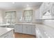 Well-lit kitchen featuring white cabinets, countertops, and modern appliances at 583 Wildflower Trail, Myrtle Beach, SC 29579