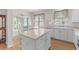 Bright kitchen with island, adjacent to dining area and access to outdoor patio at 583 Wildflower Trail, Myrtle Beach, SC 29579