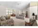 Large living room with a fan and seamless flow into the sunroom and dining area at 583 Wildflower Trail, Myrtle Beach, SC 29579