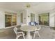 Outdoor seating area with screened porch, providing a comfortable view at 583 Wildflower Trail, Myrtle Beach, SC 29579