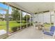 Screened porch with golf course view and an outdoor seating area at 583 Wildflower Trail, Myrtle Beach, SC 29579