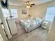 This lovely bedroom features a queen bed, dresser, and a ceiling fan for an inviting and comfortable retreat at 6001-B5 S Kings Hwy., Myrtle Beach, SC 29575