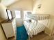 This attic bedroom features a bunk bed, dresser, and a small deck at 6001-B5 S Kings Hwy., Myrtle Beach, SC 29575