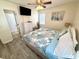 This charming bedroom features a queen bed, dresser, TV, and an ensuite bathroom for a comfortable and relaxing stay at 6001-B5 S Kings Hwy., Myrtle Beach, SC 29575