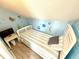 Bright bedroom with decor accents, light colored wood-look floors, and a TV at 6001-B5 S Kings Hwy., Myrtle Beach, SC 29575