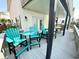 Deck with blue chairs, white railings, and seating at 6001-B5 S Kings Hwy., Myrtle Beach, SC 29575