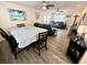 The dining area and living room create an open concept space with lots of natural light and stylish furnishings at 6001-B5 S Kings Hwy., Myrtle Beach, SC 29575