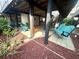 Ground level includes outdoor chairs, red gravel, and a porch swing at 6001-B5 S Kings Hwy., Myrtle Beach, SC 29575