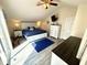 This beautiful main bedroom has a coastal style with a king bed and white dressers, with lots of natural light at 6001-B5 S Kings Hwy., Myrtle Beach, SC 29575
