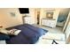 This main bedroom has a king size bed, white dressers, and an en-suite bathroom for ultimate comfort and privacy at 6001-B5 S Kings Hwy., Myrtle Beach, SC 29575