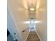 The home's interior stairwell is illuminated by a modern light fixture at 6001-B5 S Kings Hwy., Myrtle Beach, SC 29575
