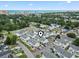 An aerial view featuring a residential neighborhood near a commercial district and scenic beach at 611 2Nd Ave. S # 18-C, North Myrtle Beach, SC 29582