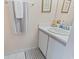 Bright bathroom with a white vanity, neutral-toned walls, and a decorative rug for added comfort at 611 2Nd Ave. S # 18-C, North Myrtle Beach, SC 29582