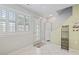 Entryway and tile flooring lead to a kitchen with stainless steel appliances at 611 2Nd Ave. S # 18-C, North Myrtle Beach, SC 29582