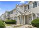 Inviting townhouse exterior with well-maintained landscaping and neutral siding at 611 2Nd Ave. S # 18-C, North Myrtle Beach, SC 29582