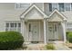 Charming townhouse entrance with covered porch and decorative welcome sign at 611 2Nd Ave. S # 18-C, North Myrtle Beach, SC 29582